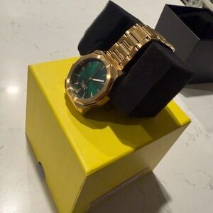 Invicta Gold Timepiece with Emerald Dial